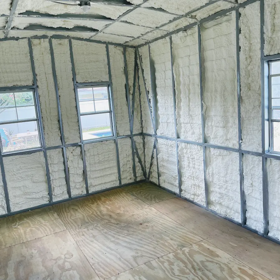 Closed-cell spray foam insulation applied to wall cavities in a residential project in Girard